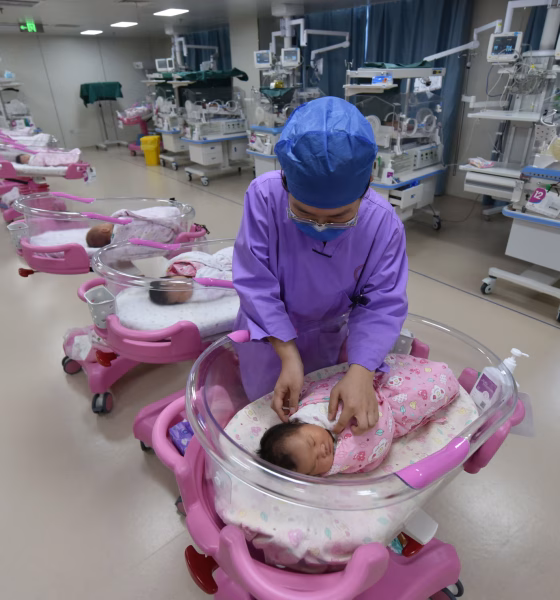 A Nurse Takes Care Of Newborn
