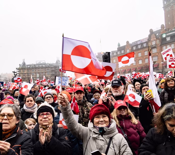 Protesters Wave Greenland Flags
